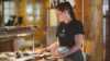 Woman organizing buffet at Saltdal Turistsenter.