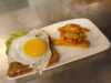 Egg and chips on a plate at Oasen Kafé