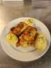 Fries fish with potatos, on a plate.